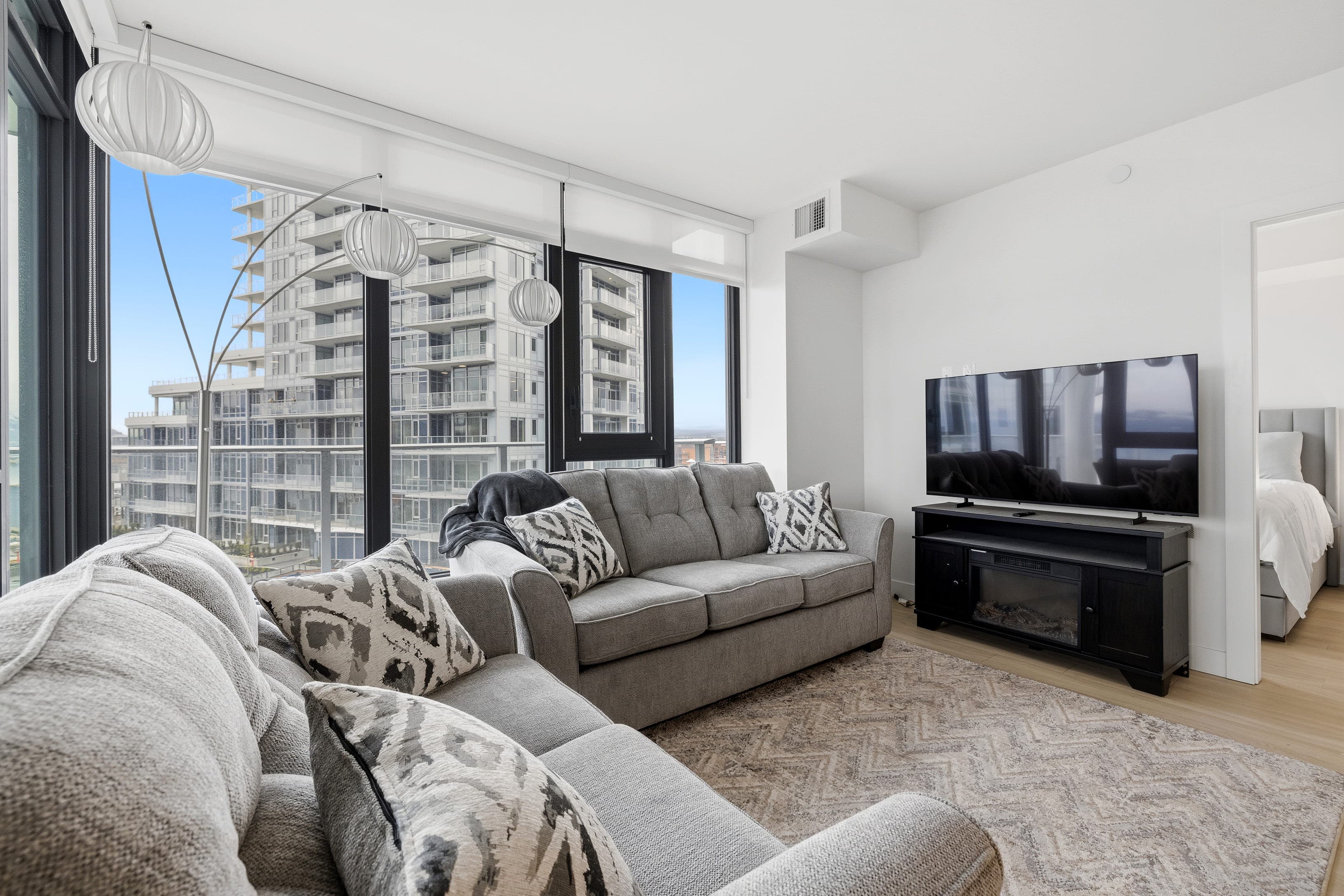 Living room with fireplace and lake view